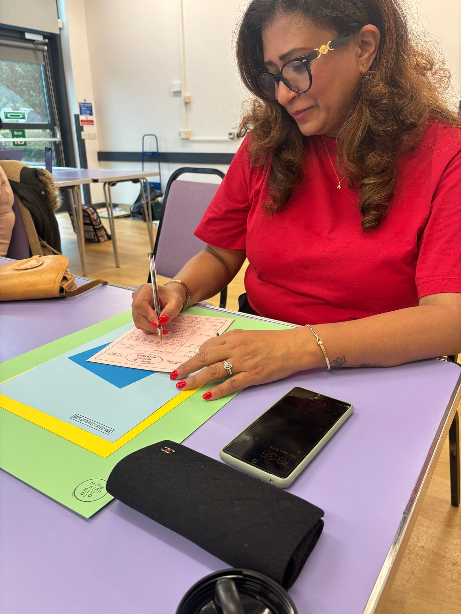 Person writing research notes in a notebook